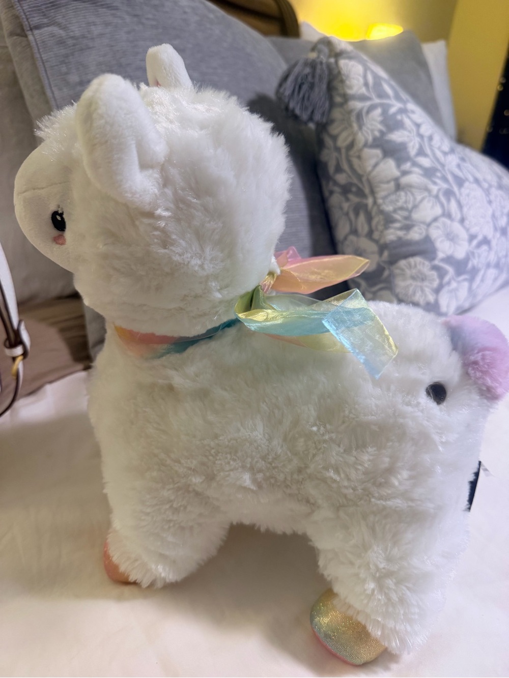 FAO Schwarz Light Up White Plush Alpaca with Pastel Rainbow Ribbon
